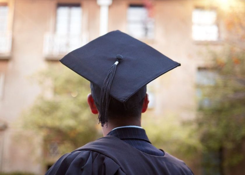 Thinking graduate, man or vision on university campus, college event or school graduation ceremony and future goals. Graduation cap, robe or student with education, learning or employment opportunity