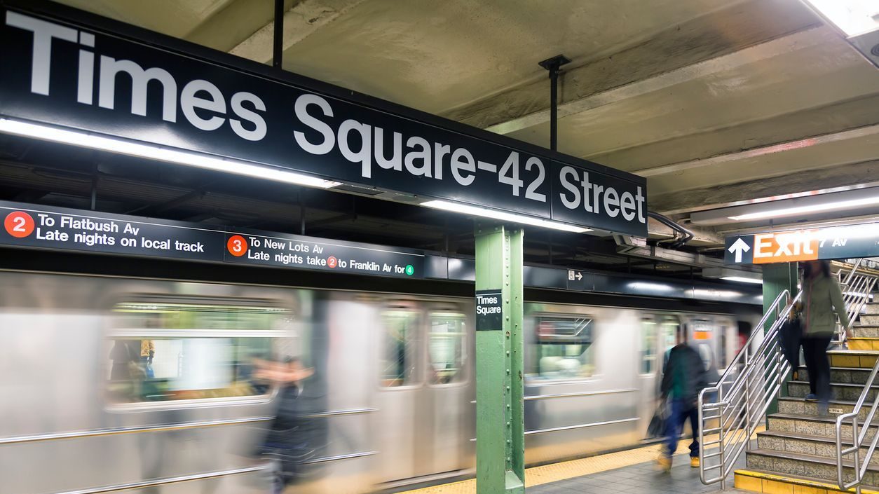 Commuters at Times Square Subway Station in New York City