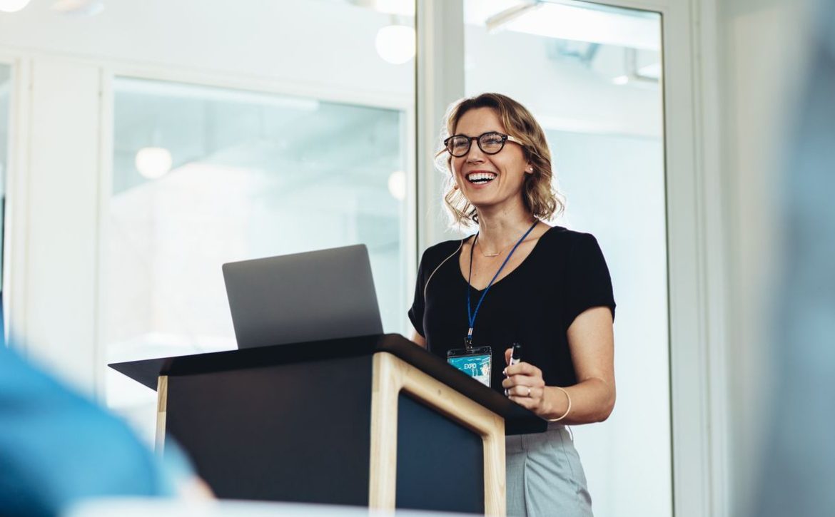 Female business professional addressing a seminar